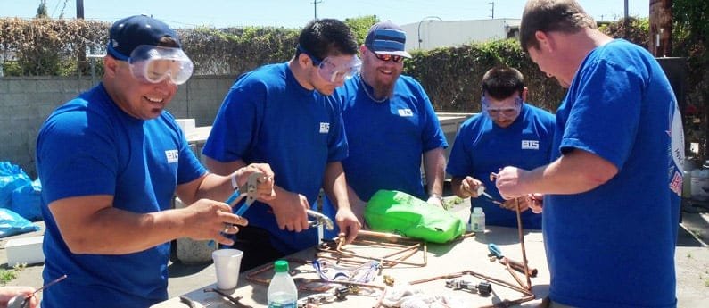 A group of Brownson Technical School Students working outside on a project 