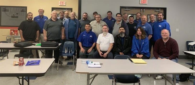 HVACR educators and trainers posing together for a group photo.